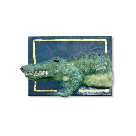 Alligator breaking out of a gold-leaf border on blue 5x7 canvas, paper mache art by Annie Aymond