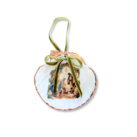Decoupage scallop shell ornament with the Holy Family, Joseph holding the infant Jesus, gilded edge, and sage velvet ribbon by Melissa Fouts.