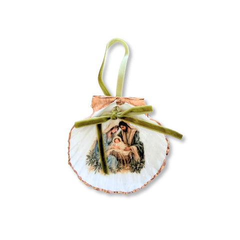 Decoupage scallop shell ornament with a nativity manger scene, gilded edge, and sage velvet ribbon by Melissa Fouts.