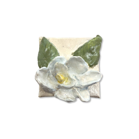 White magnolia blossom with green leaves on 5x5 canvas, paper mache art by Annie Aymond