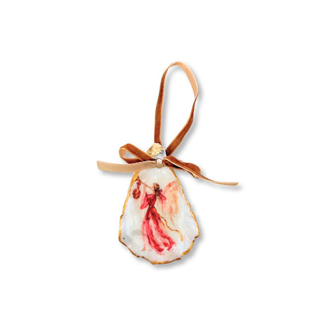 Decoupage oyster shell ornament with a rose-robed angel playing a trumpet, gilded rim, and copper velvet ribbon by Melissa Fouts.